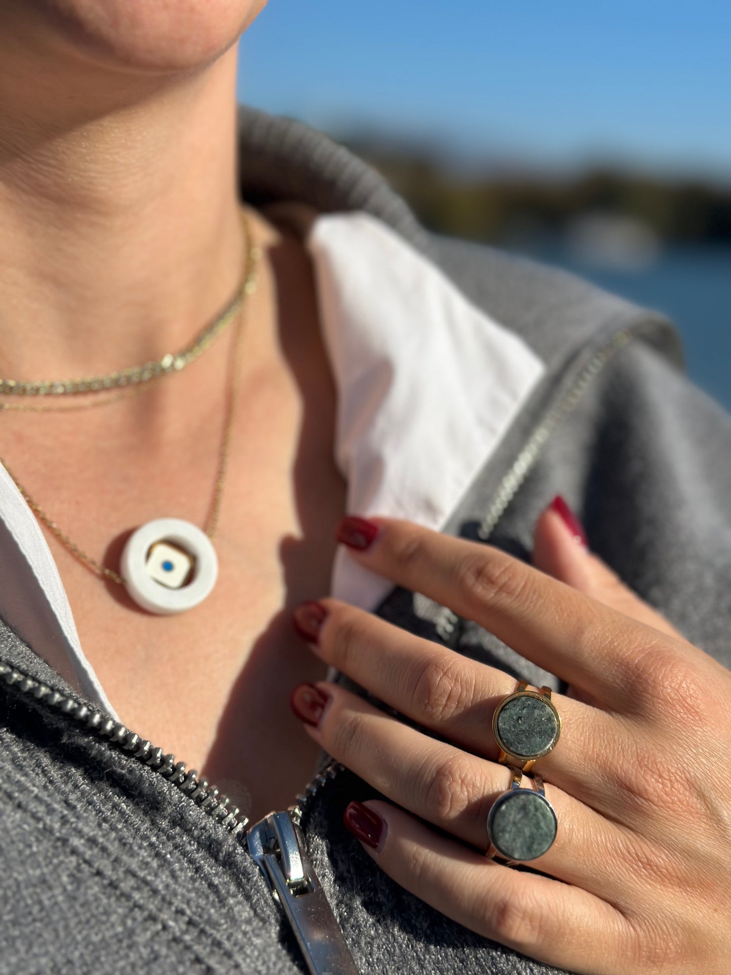 White marble circle with an internal square steel eyelet