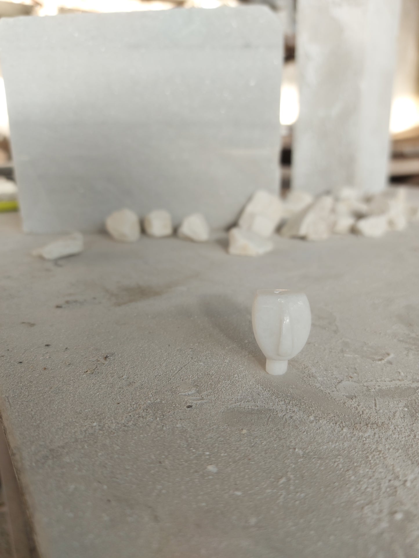 Cycladic figurine made of white marble with string