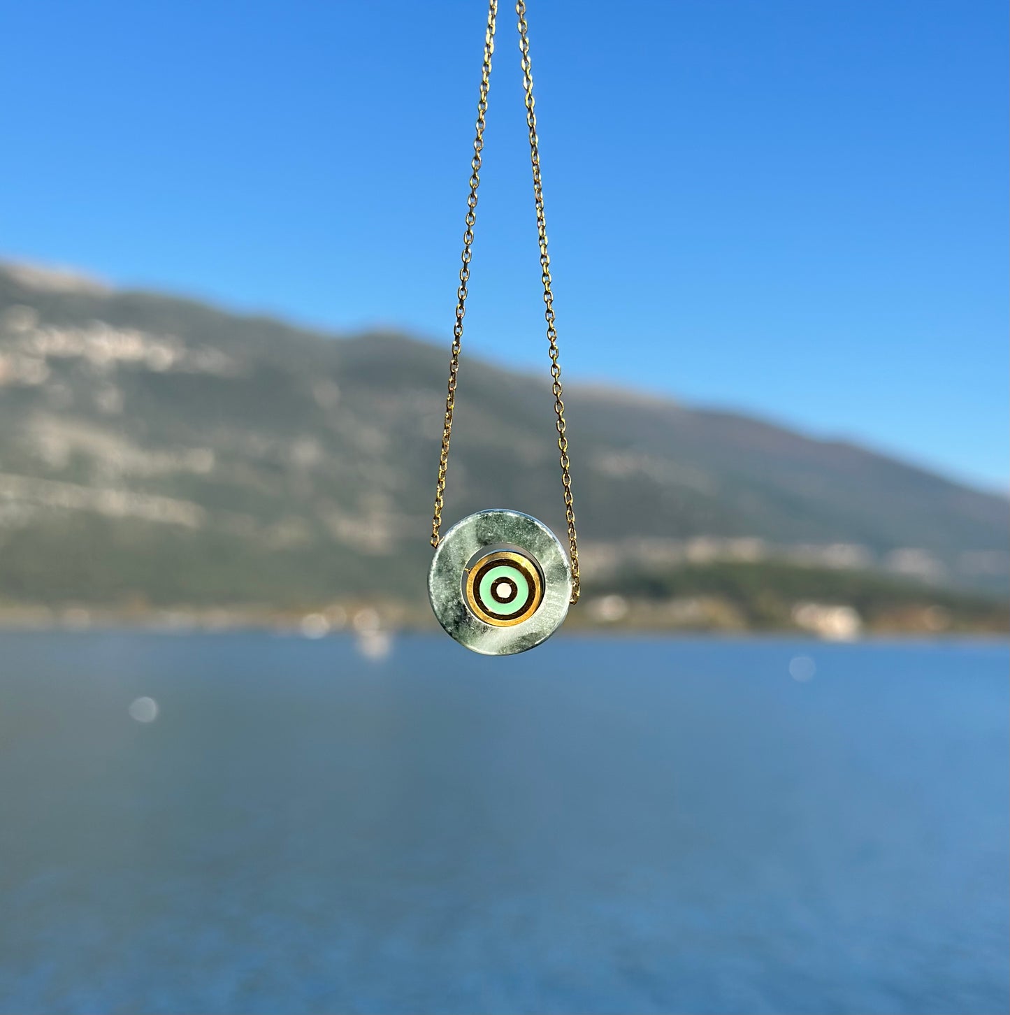 Circle made of green Tinos marble with an internal steel green eye