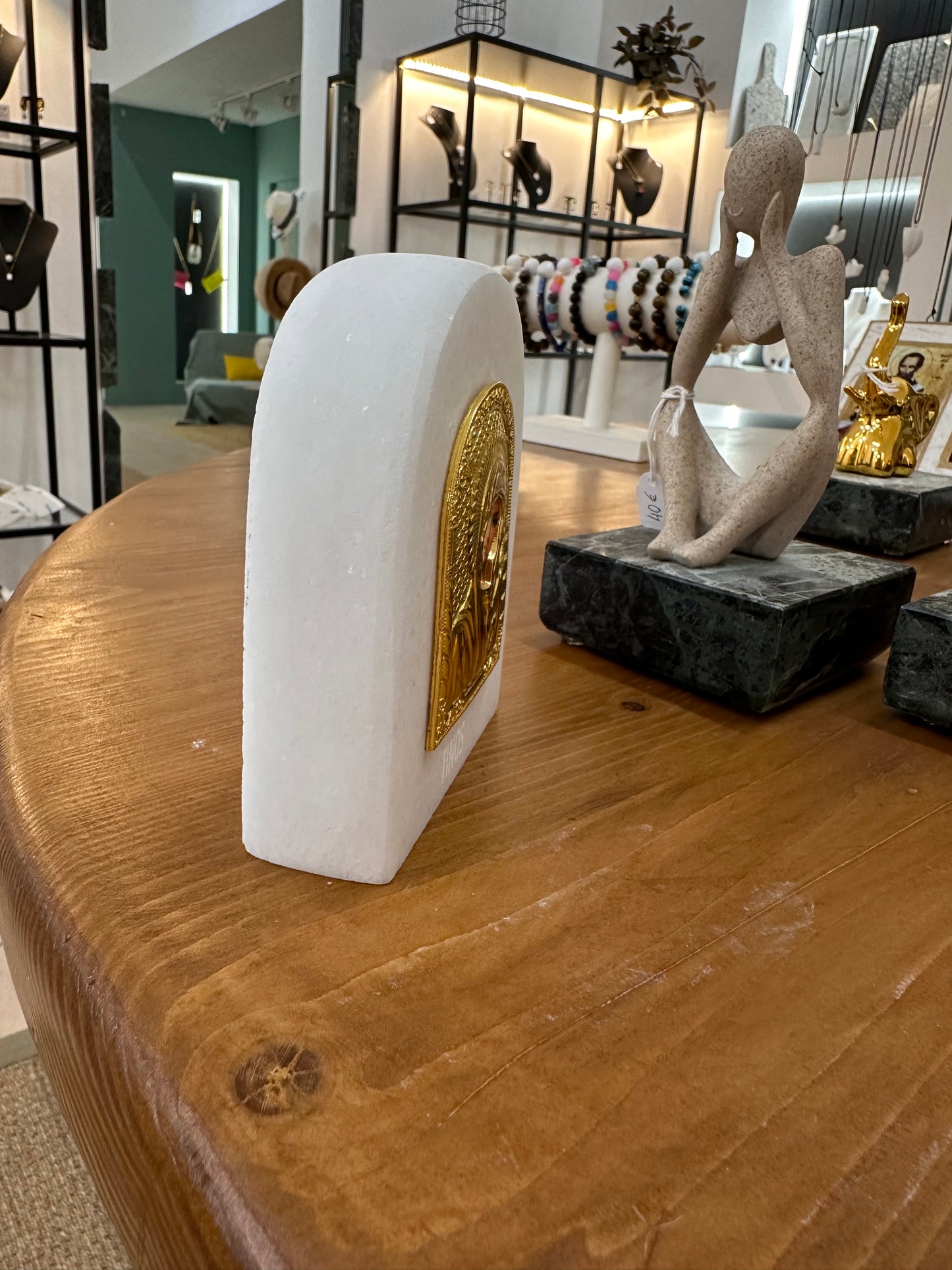 The Virgin Mary in a golden depiction on 3 cm thick white marble