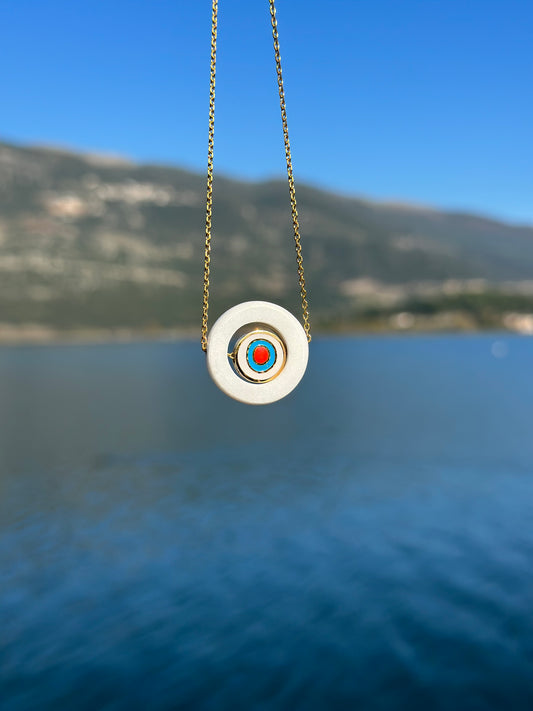 White marble circle with internal steel circular eyelet