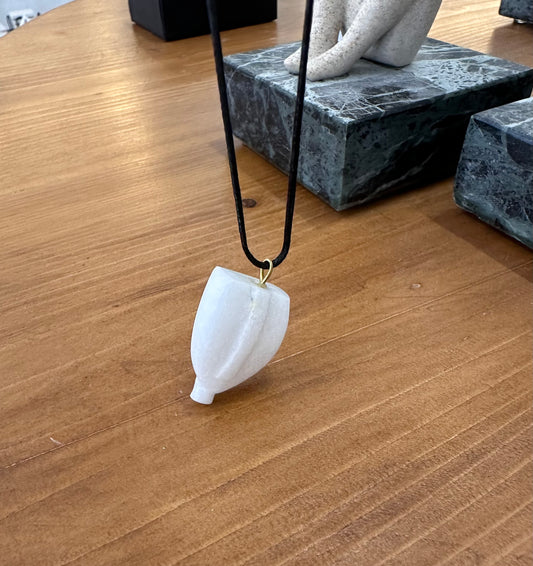 Cycladic figurine made of white marble with string