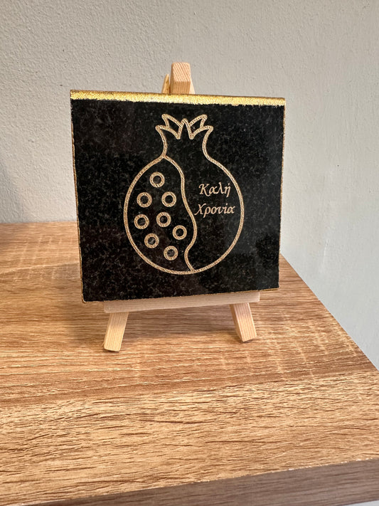 Good year pomegranate charm engraved on black granite with gold letters and wooden base