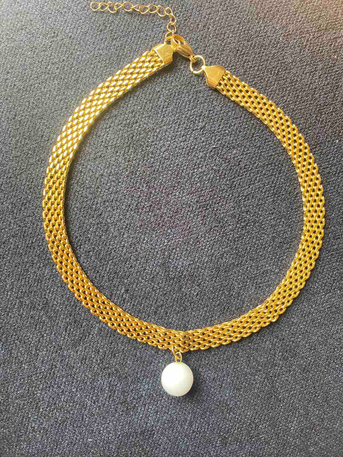 White marble ball on a choker chain