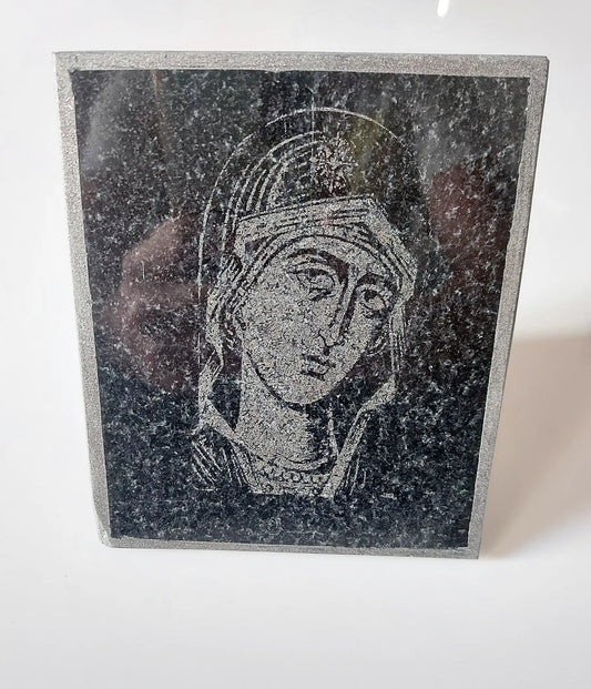 Icon of the Virgin Mary carved on black granite. Dimensions 12*15
